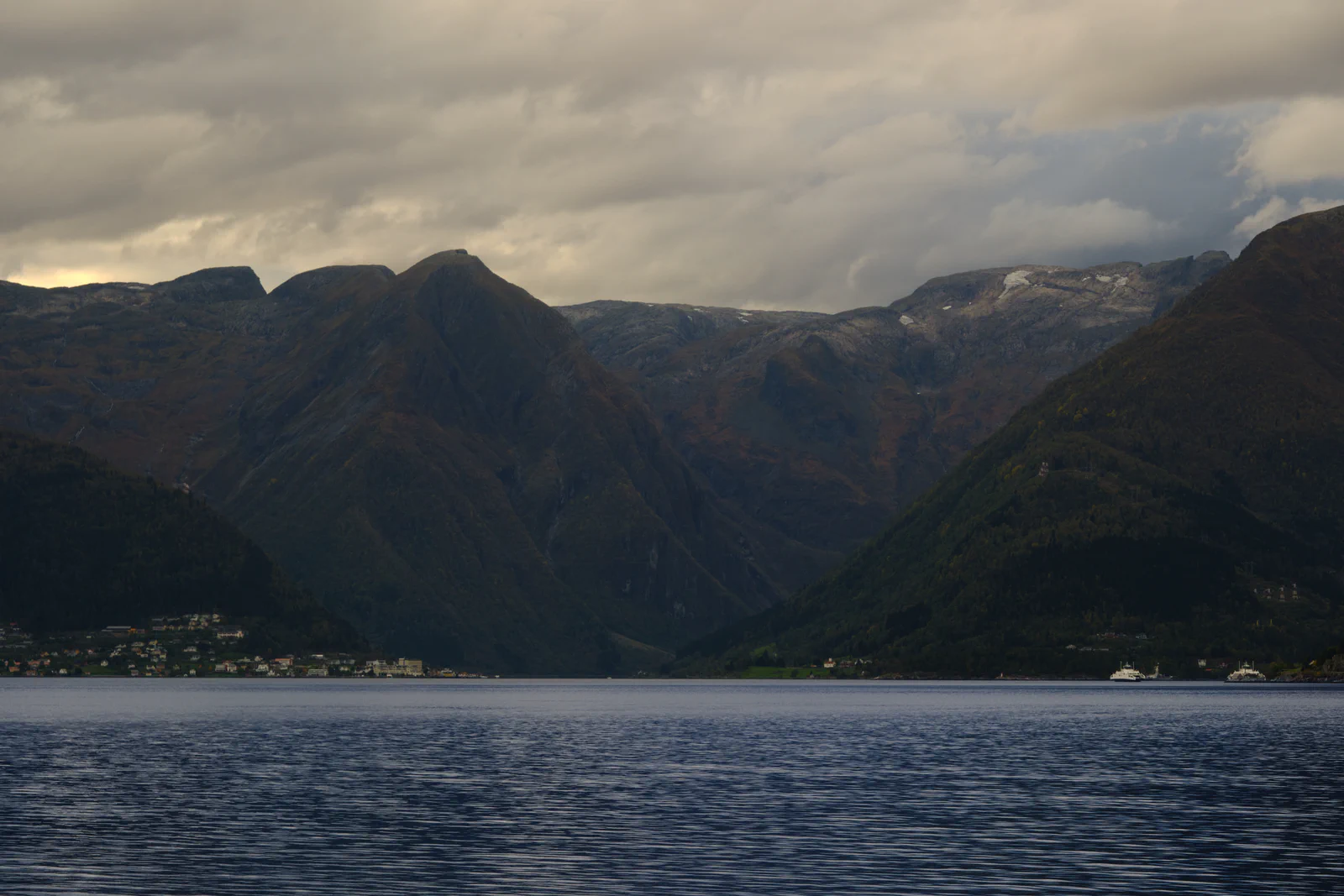 Mountains and a village on the shore of a fjord