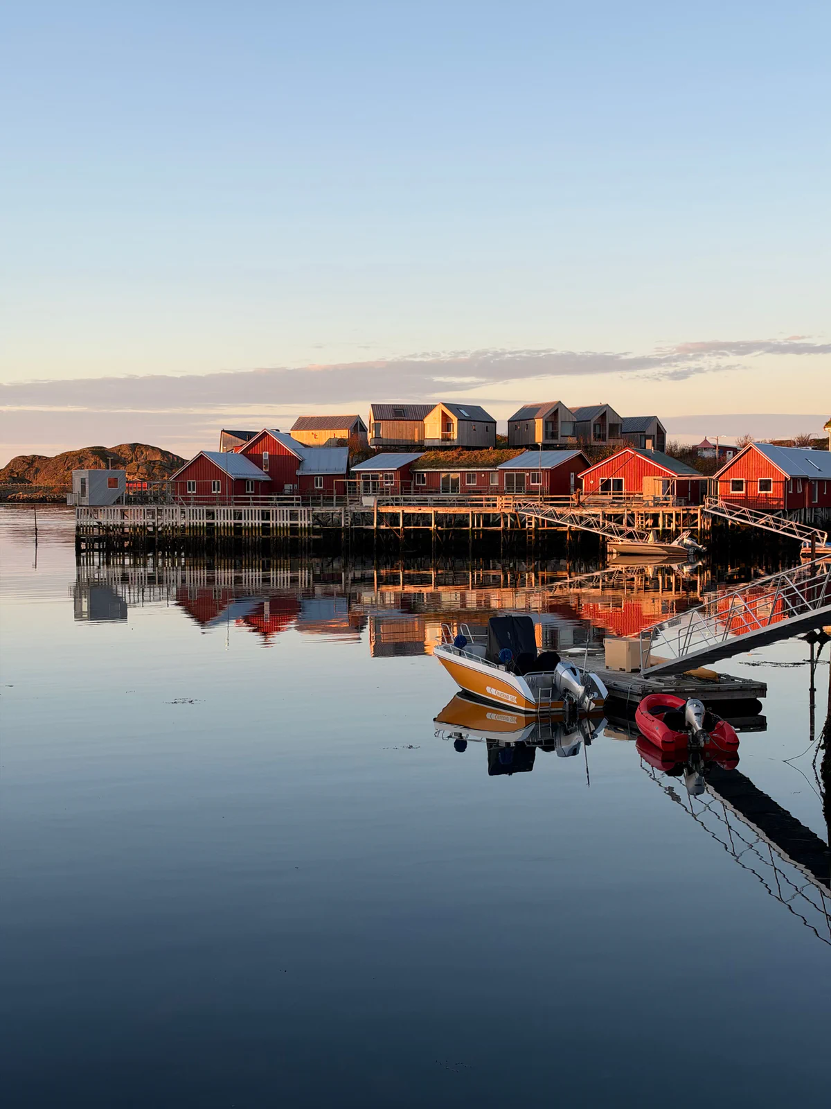 Red fishing cabins at sunset